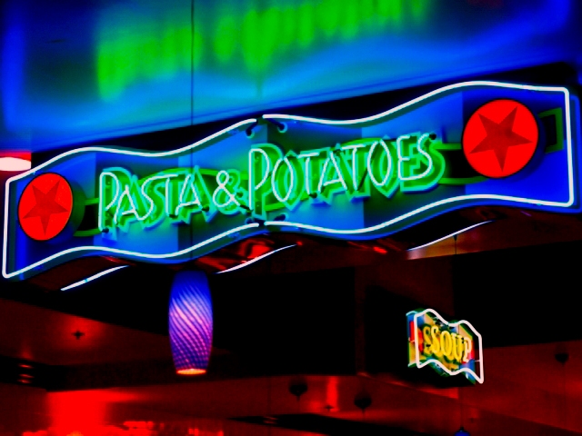 Neon Mounted On Contour Cut Piece of Acrylic, Hung With A Chain
